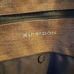 Sherpani Anti-Theft Tote.  17” across and 11” high. NWOT.  Never used.
